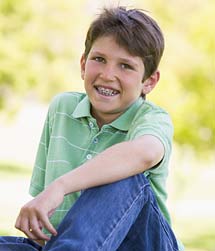 photo of a smiling boy wearing braces