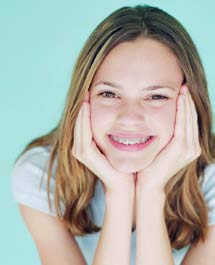 photo of a young woman wearing braces and a cute smile - the product of successful two-phase treatment